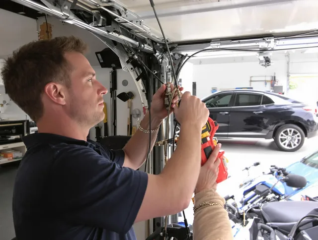 Seymour Garage Door Repair safety certified technician performing cable replacement in Seymour