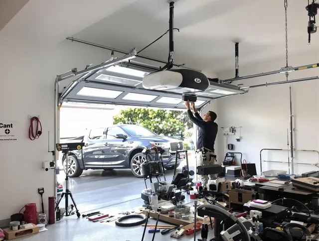 Seymour Garage Door Repair specialist installing smart garage door opener system in Seymour home