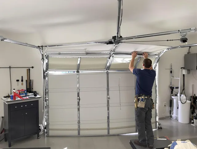 Seymour Garage Door Repair specialist performing precise section replacement on Seymour garage door